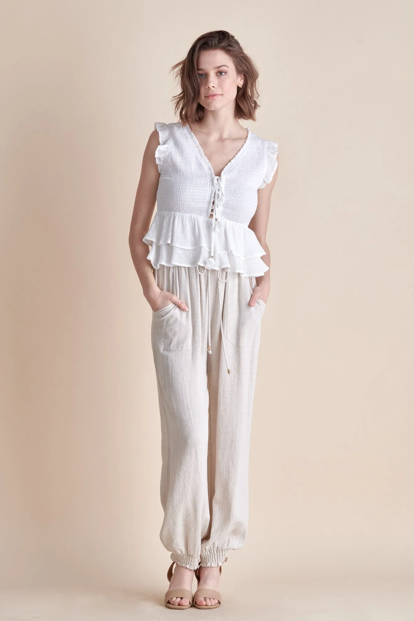 The Smocked Lace-up Top with Ruffle Detail in White